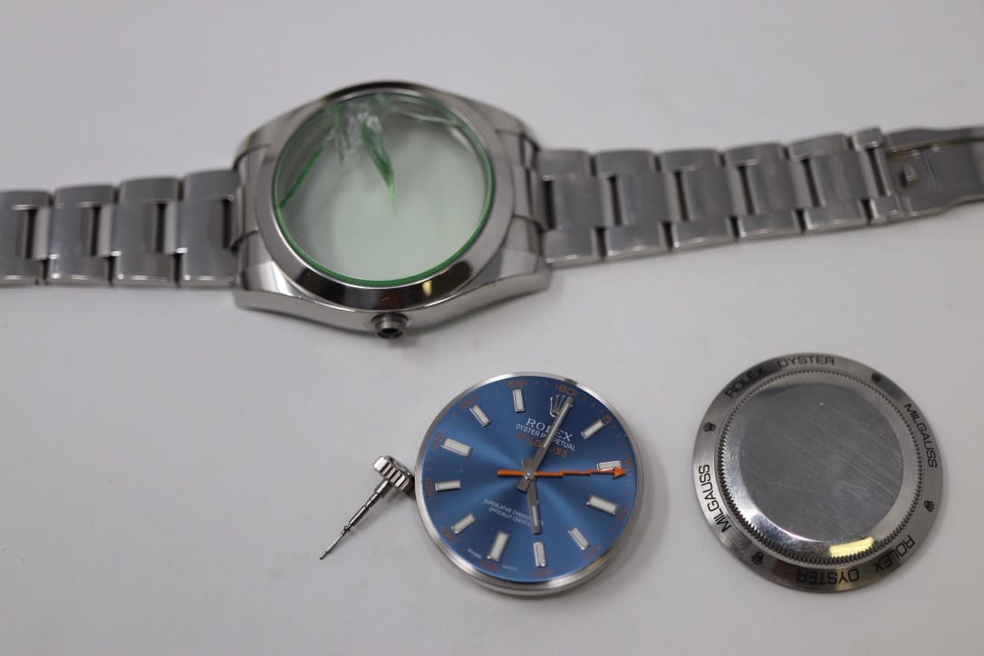 Close-Up Of Two Watch Crowns With Attached Stems — One Plain And One With Seiko 'S' Logo — Showing The Precision Components Replaced During Stem And Crown Repair At Watch Technicians