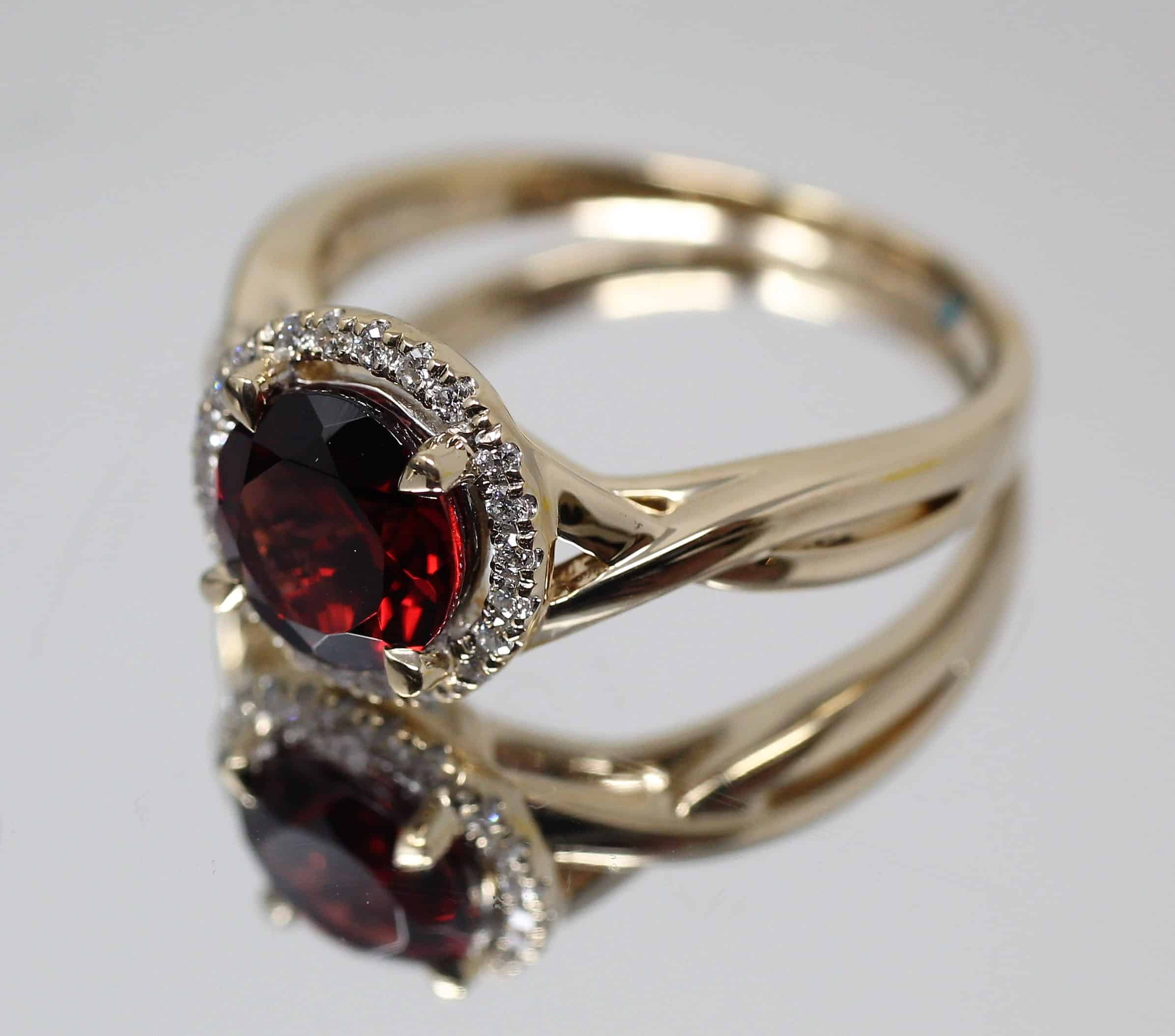 Gold Ring With Garnet Gemstone And Diamond Halo Setting Ready For Resizing At Watch Technicians In St. Louis