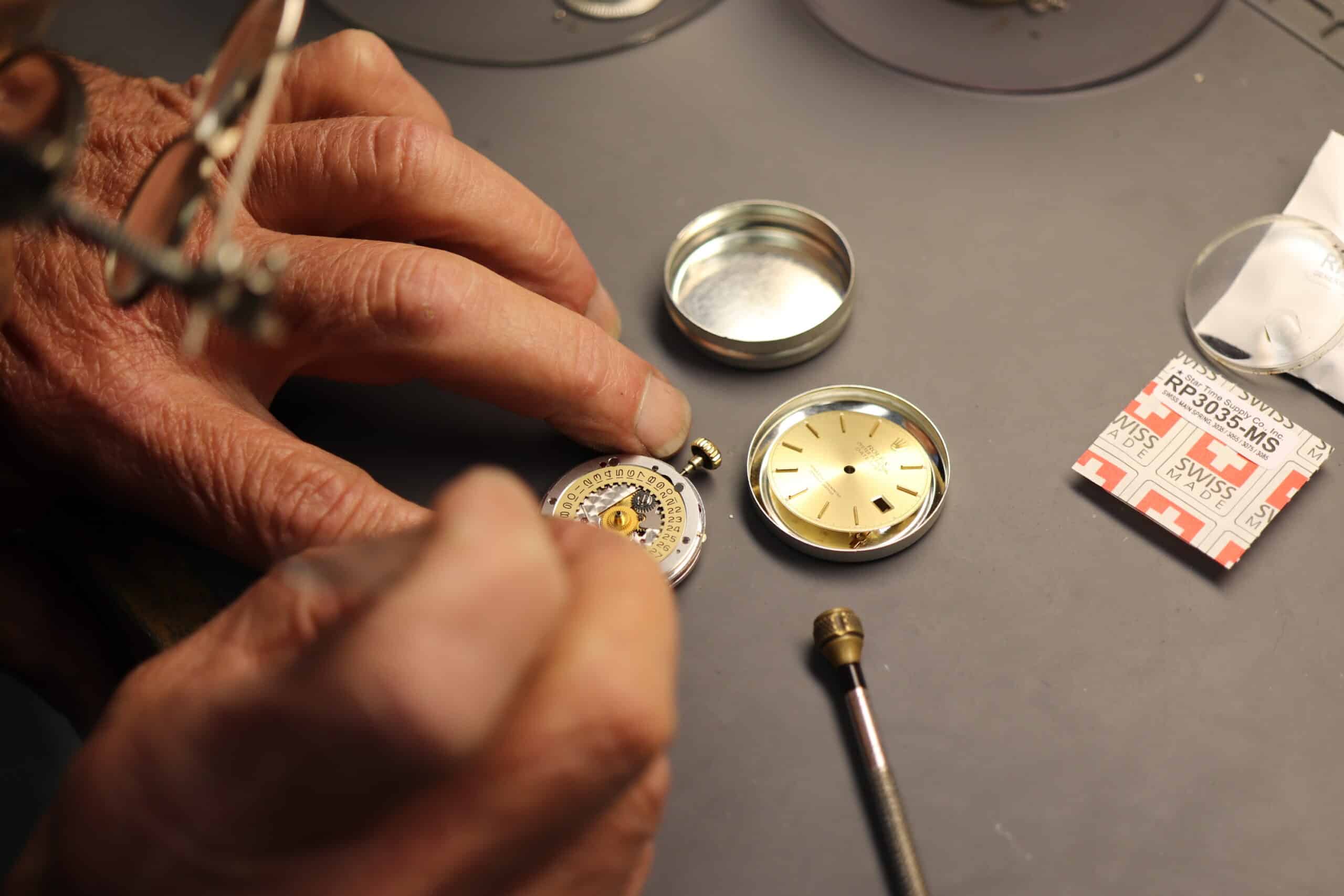Watchmaker Servicing A Rolex Movement By Hand At Watch Technicians In St. Louis