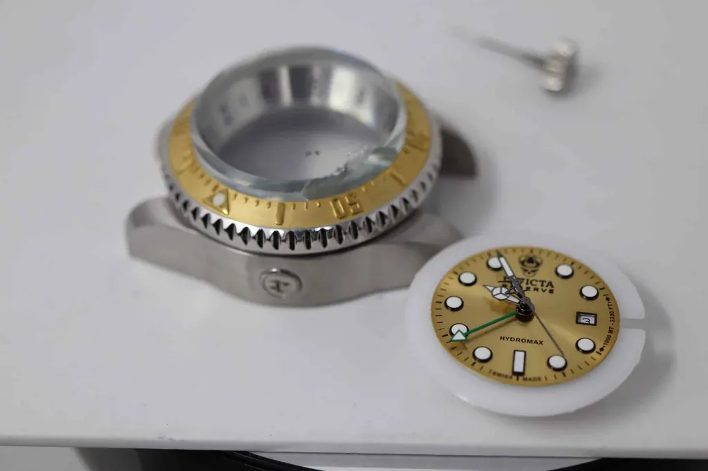 Invicta Reserve Hydromax disassembled on watchmaker's bench during repair — Watch Technicians St. Louis
